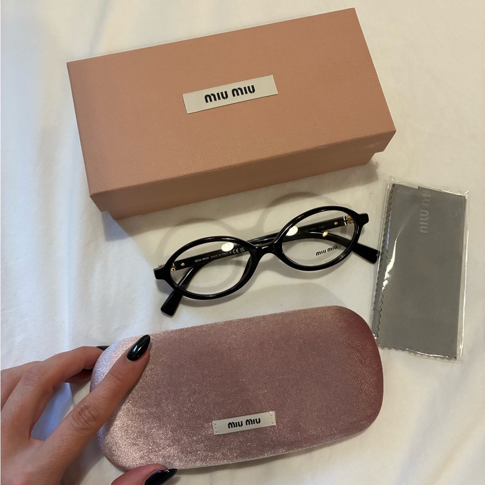 Miu Miu Black and Gold Eyewear